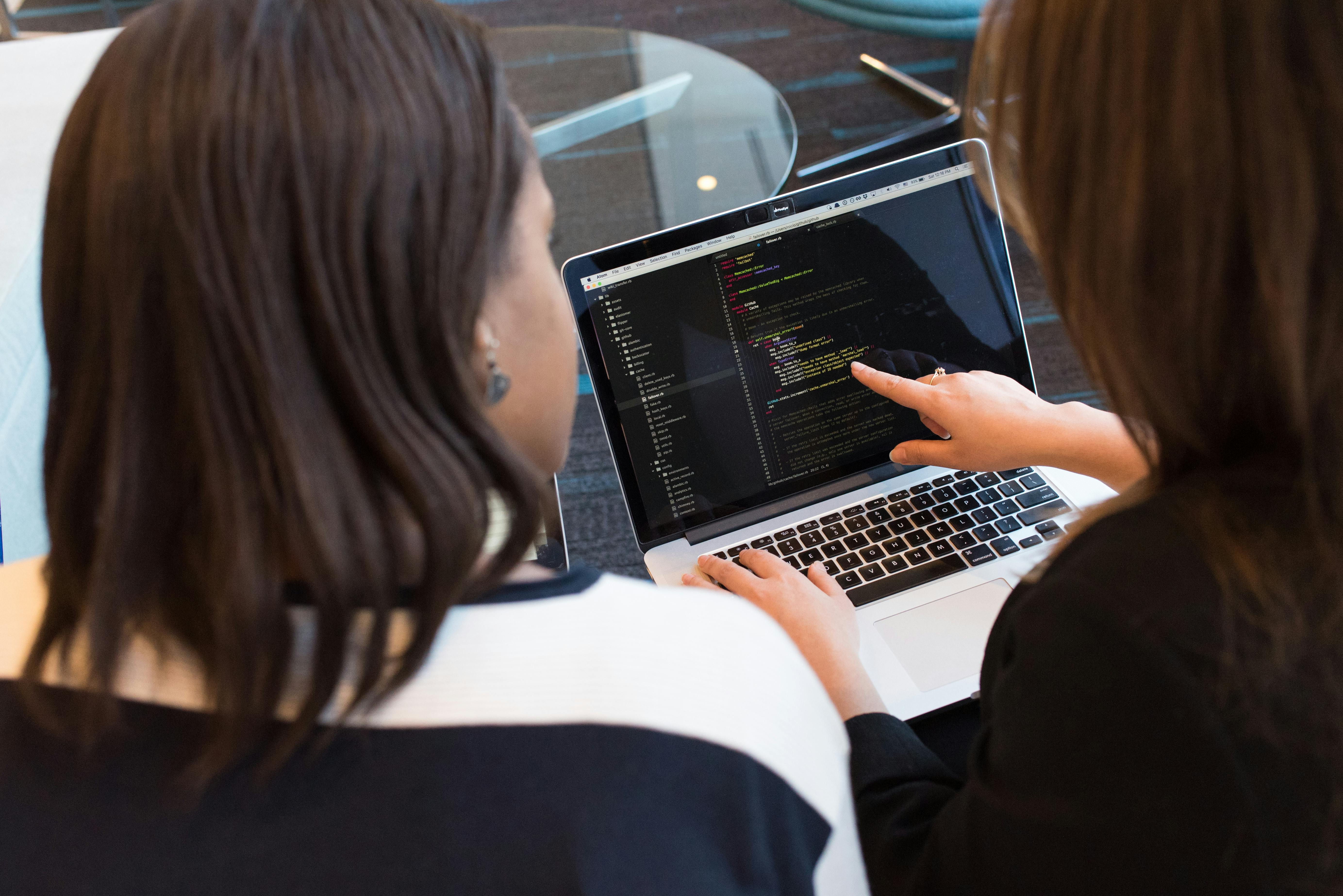 Coding a chatbot to help provide better services to the federal public. Photo by Divine Techy Girl/Christina Morillo/Pexels.