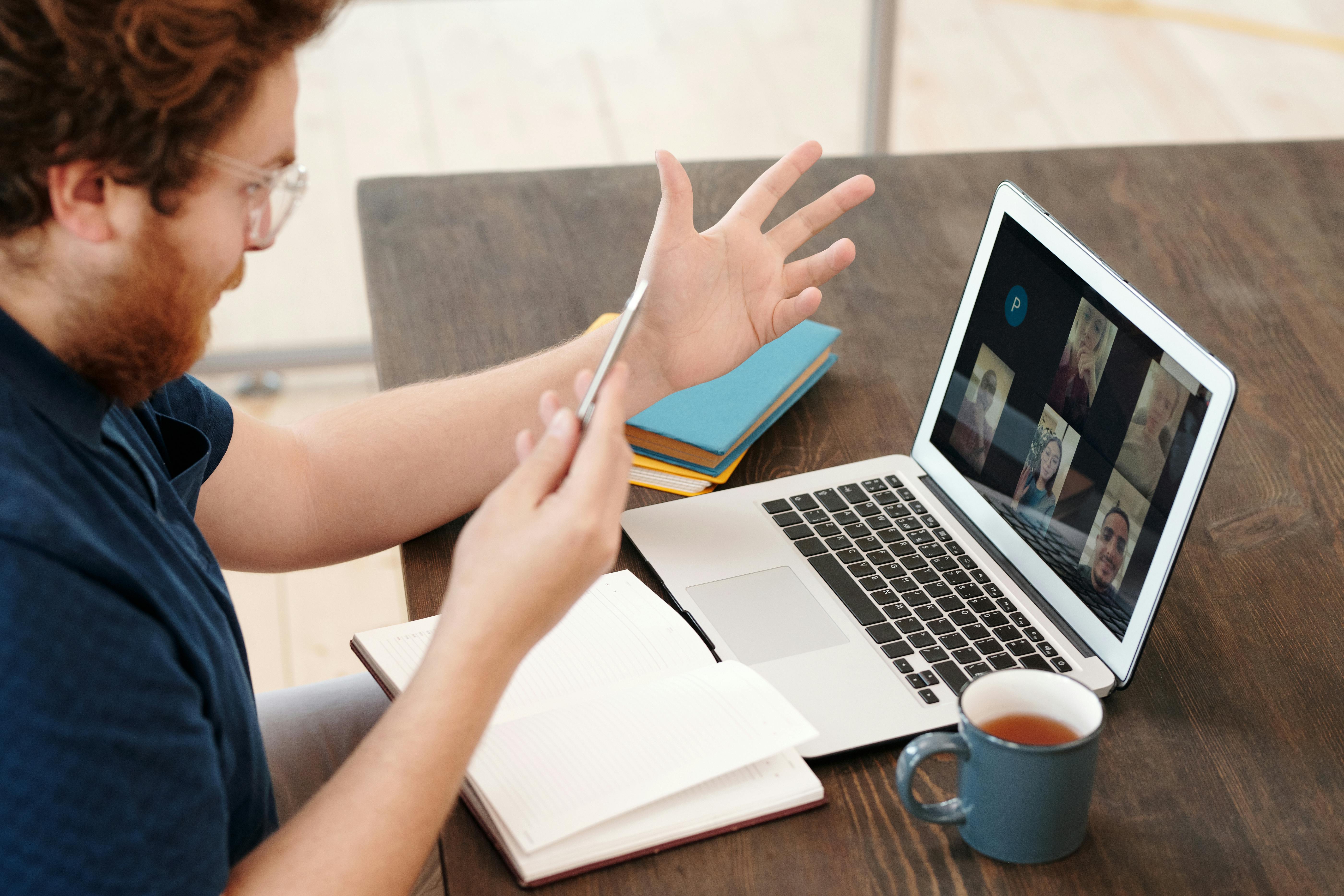 Employee engaging in a virtual team meeting to support organizational change management and communication.